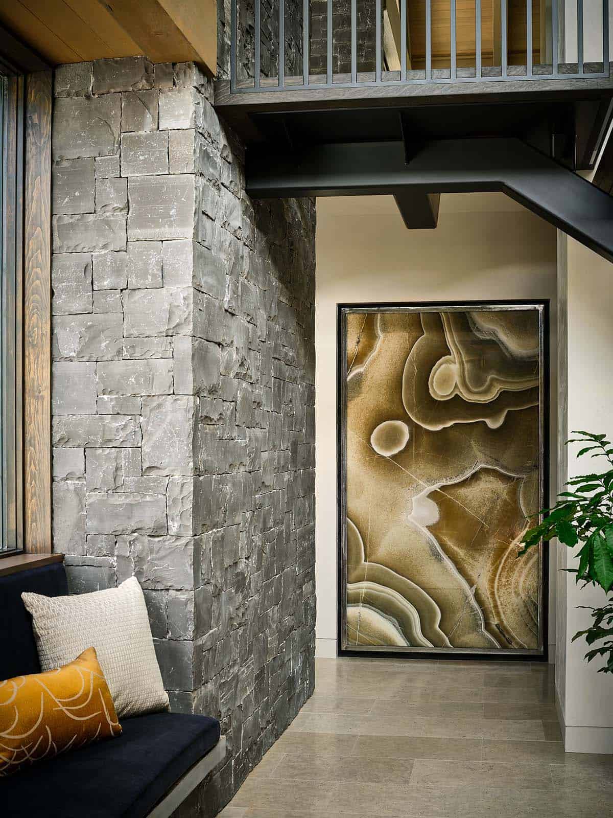 Close-up of illuminated onyx wall panel with swirling amber patterns