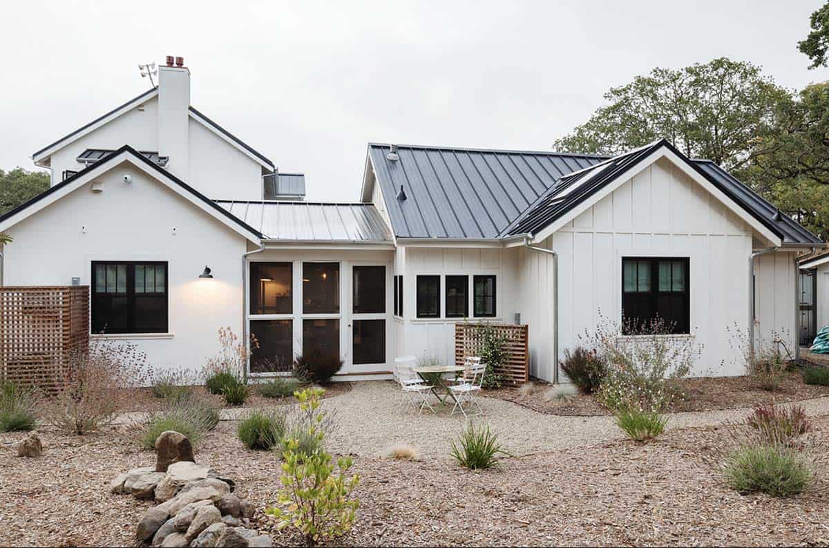Rear exterior showing multiple gabled rooflines and gravel courtyard