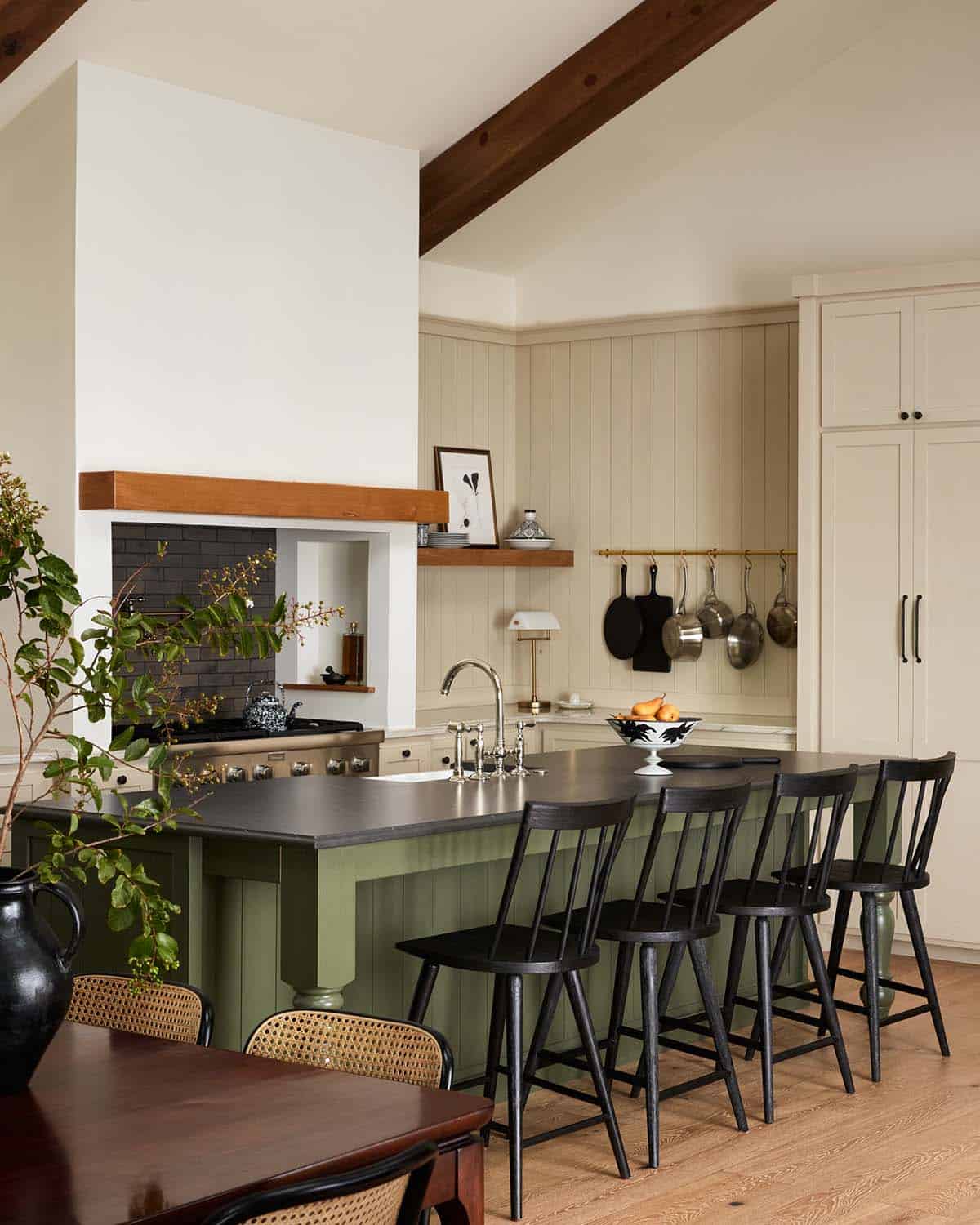 Kitchen island with olive green base and black soapstone counter