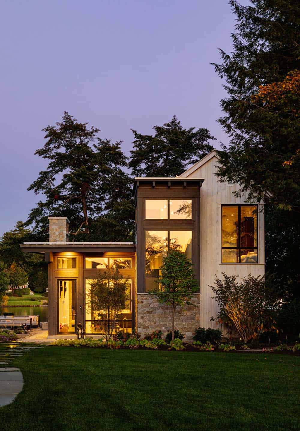 Dusk exterior of smaller wing with illuminated glass windows