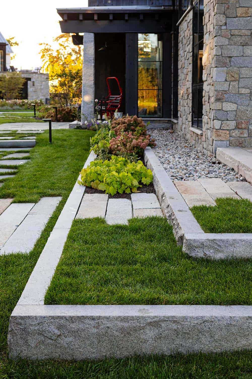 Landscaping detail with stone edging and garden plantings