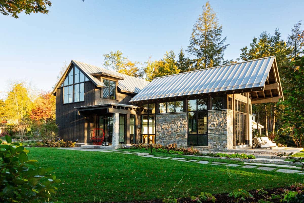 Barn exterior with stone base and standing-seam metal roof