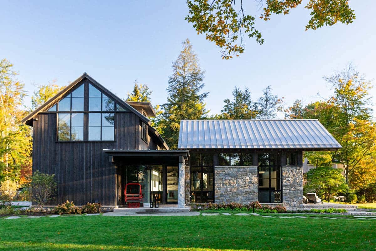 Barn exterior with glass gable and red chairlift bench