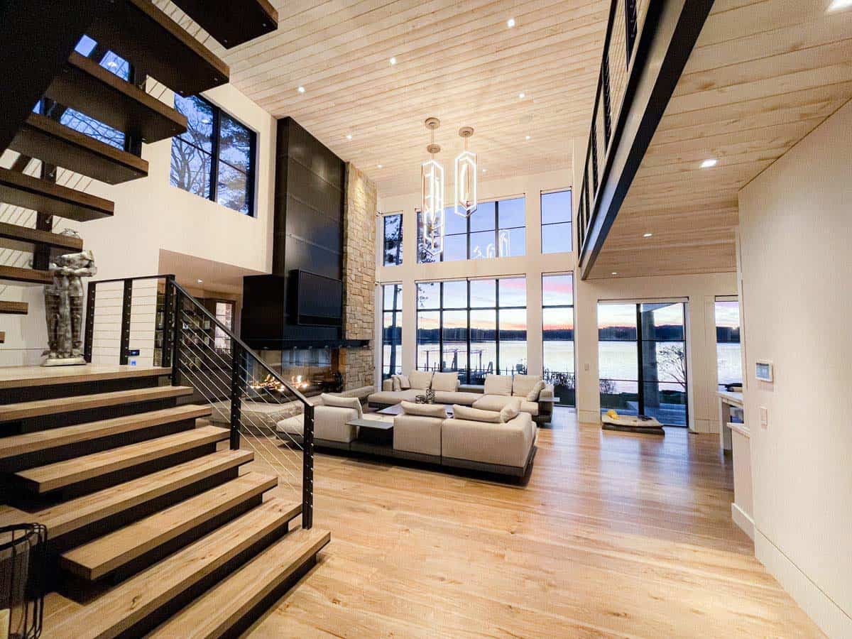 Two-story great room with floating staircase and fireplace