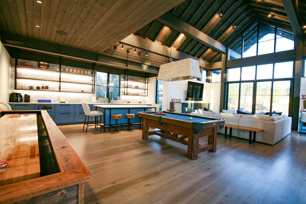 Game room with pool table, shuffleboard, and sectional seating