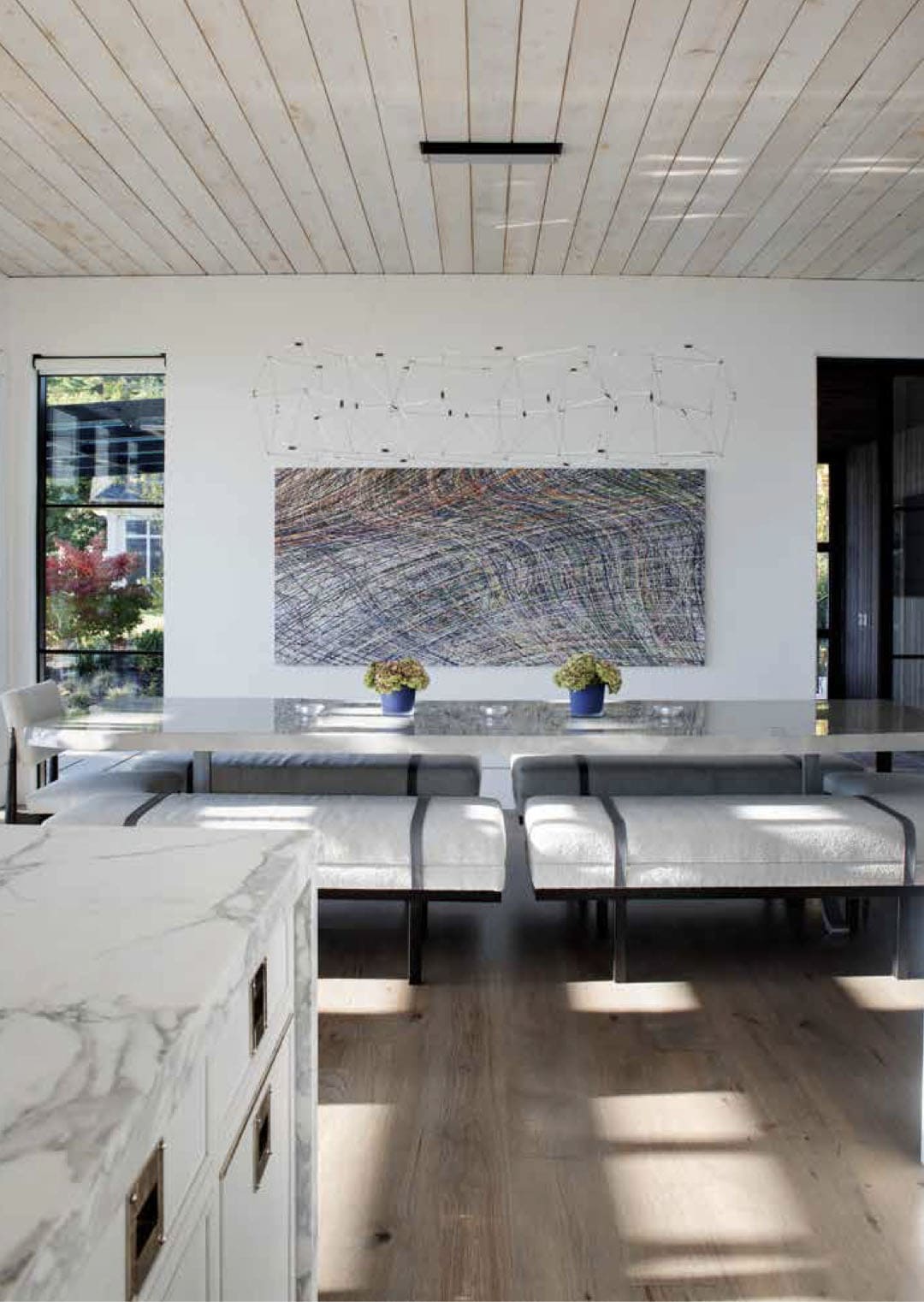 contemporary dining room with artwork on the wall