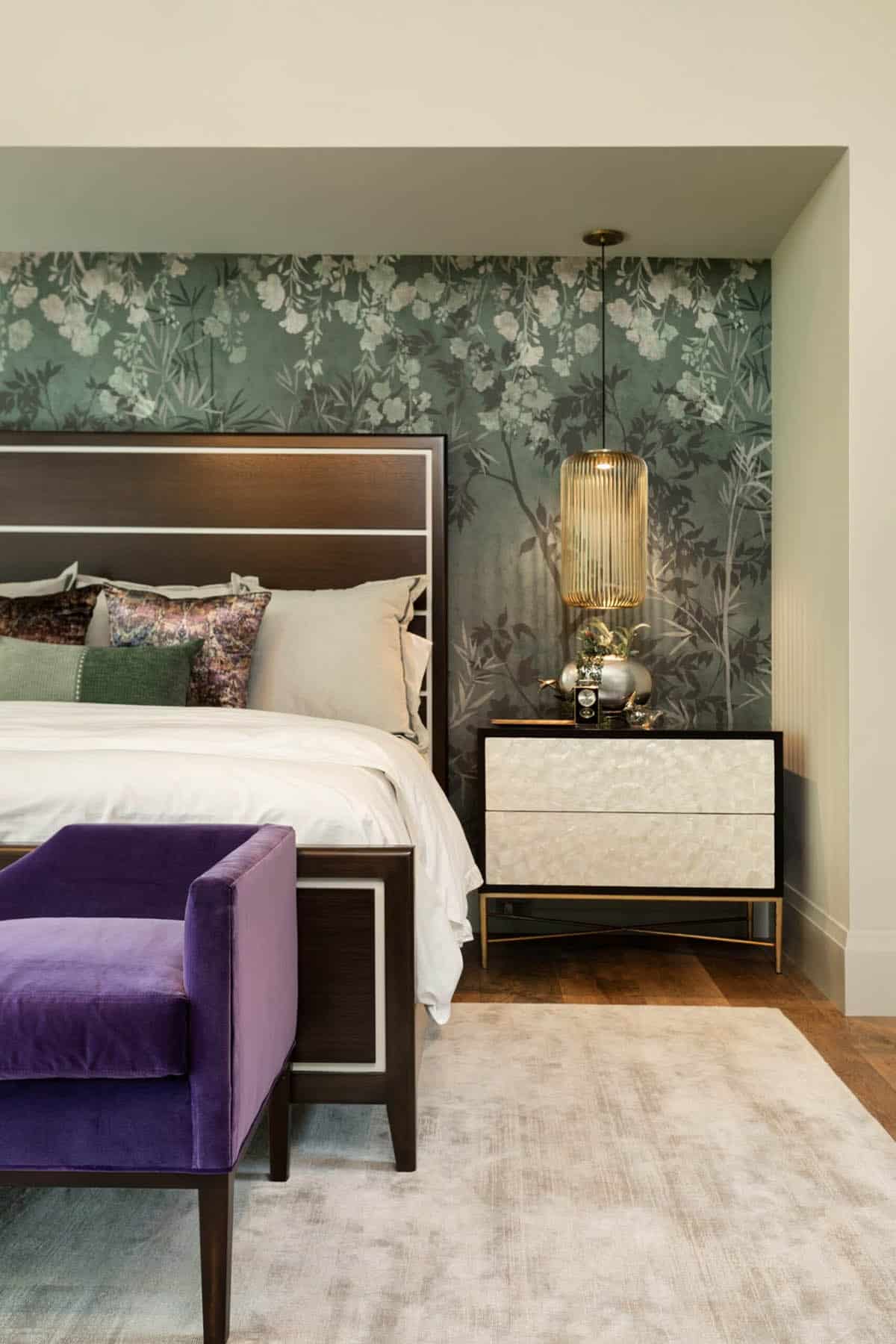 Primary bedroom nightstand vignette with capiz shell dresser and green floral wallpaper
