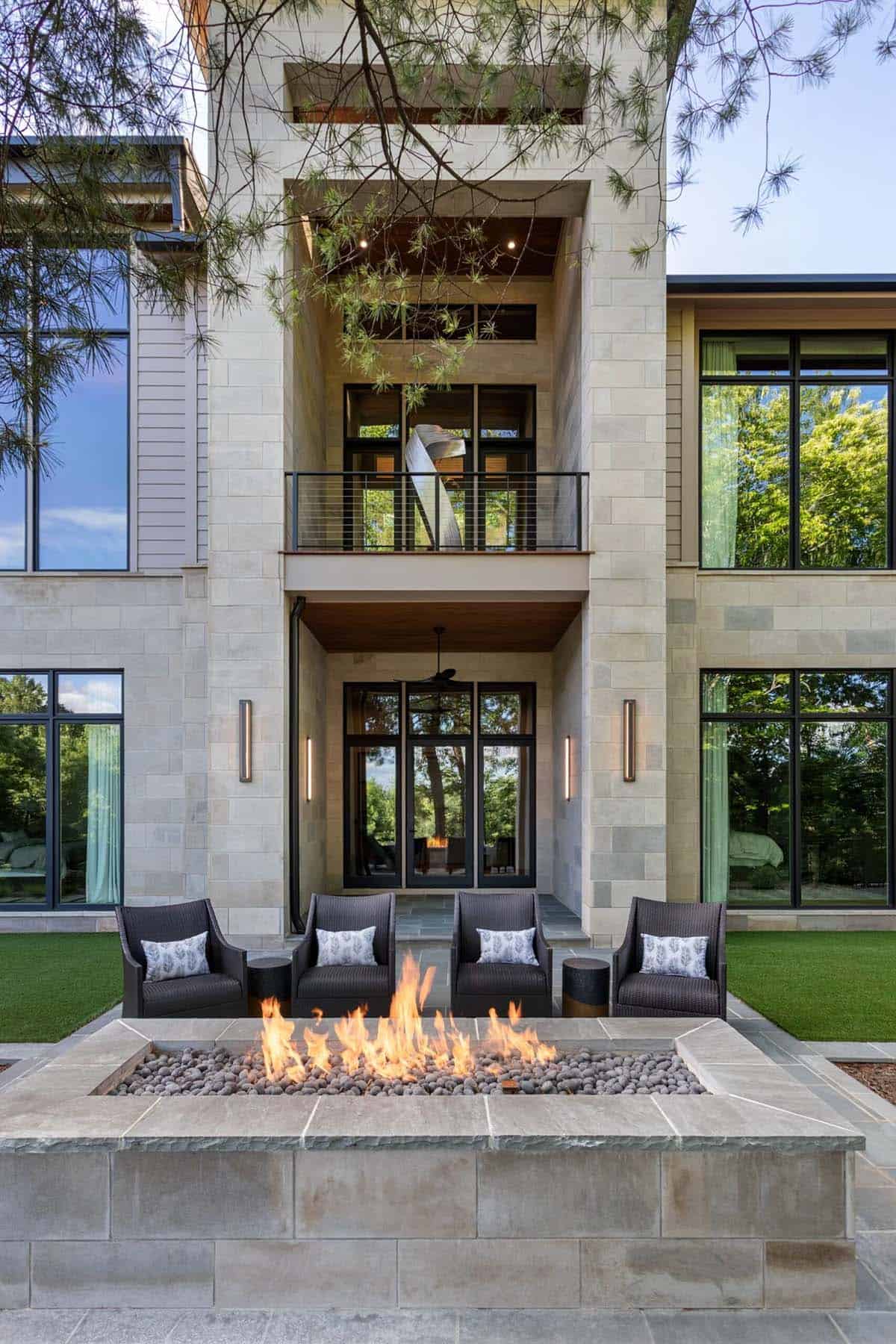 Three story stone tower with cable railing balconies and sculpture accent