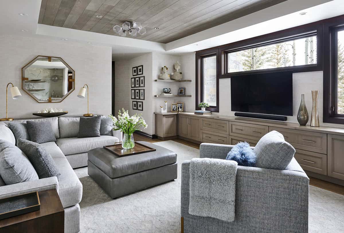 ray living room with sectional sofa, wood-paneled ceiling, and built-in media cabinet