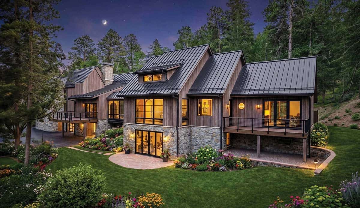 Modern mountain home exterior at dusk