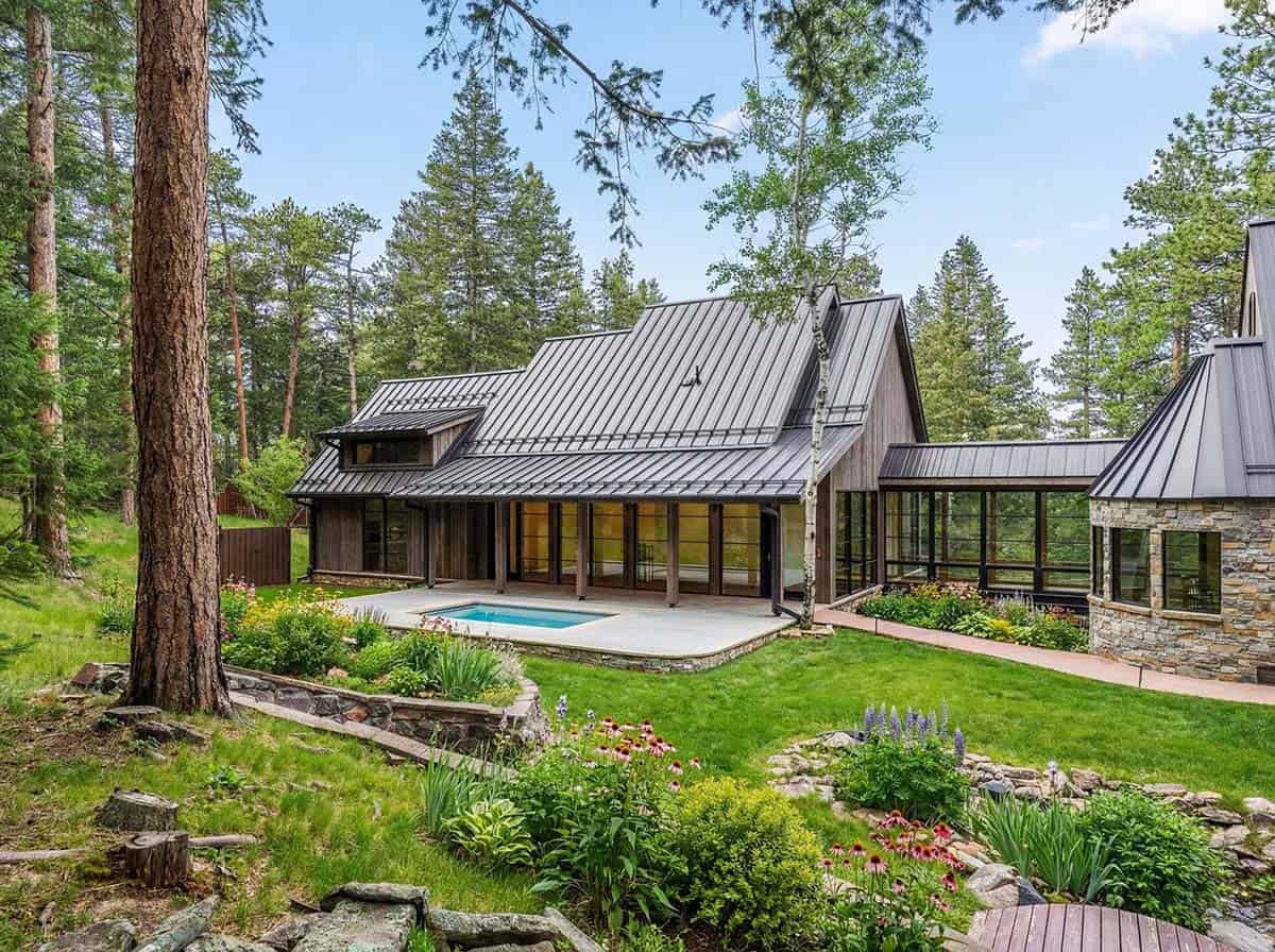 Standing-seam roof shelters a stone patio and plunge pool
