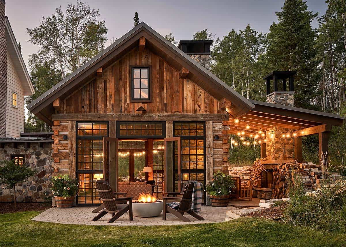 Rustic cabin patio with fire pit and string lights