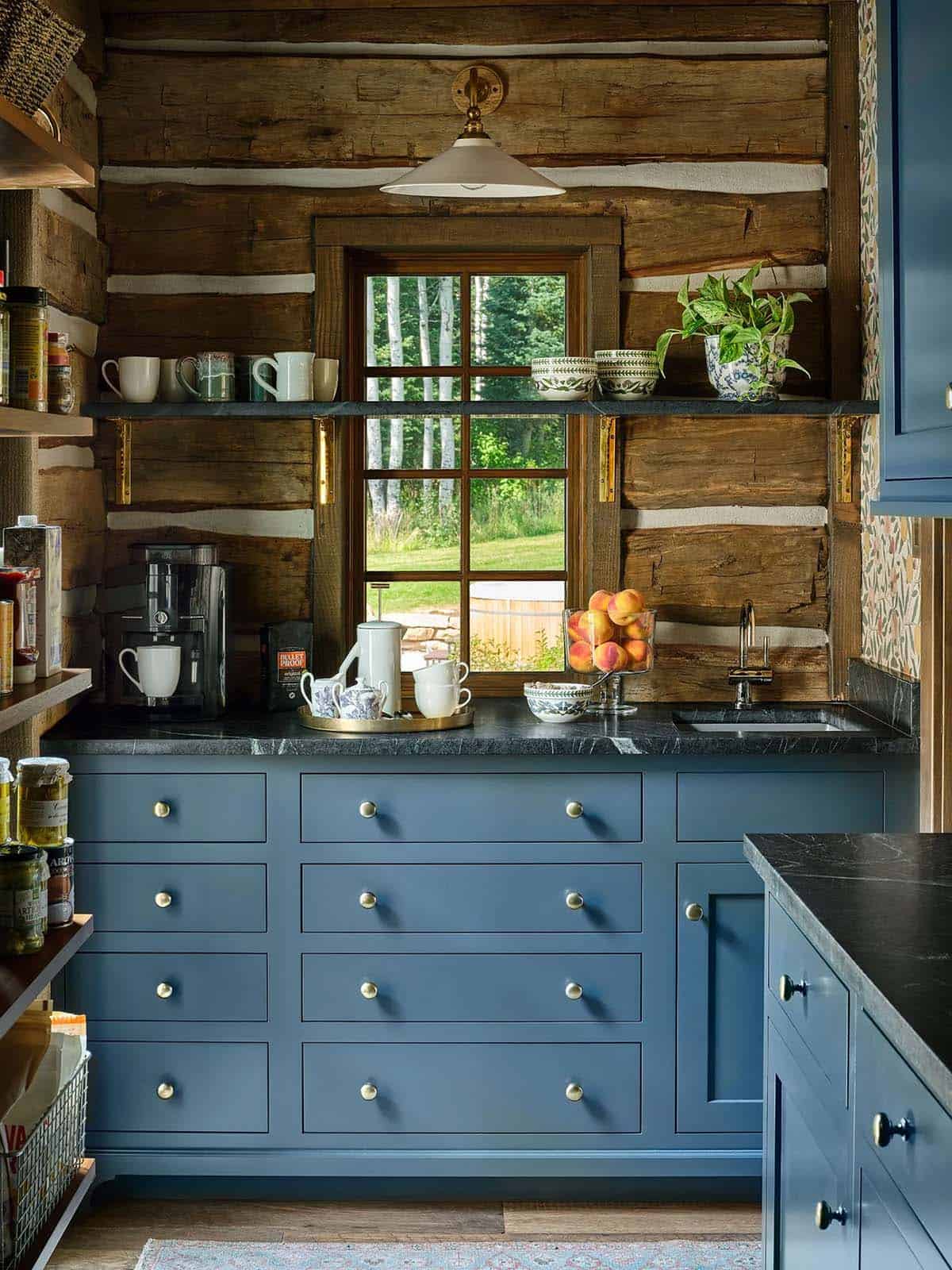 Butler's pantry with navy drawers and soapstone countertop