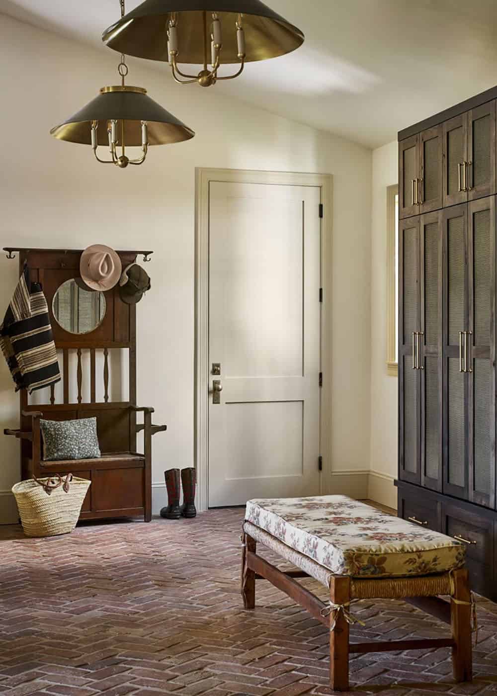 Entryway with vintage hall tree and floral bench cushion