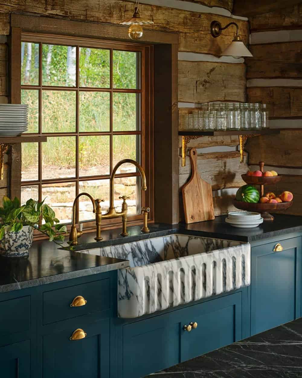 Marble farmhouse sink with brass gooseneck faucet fixtures