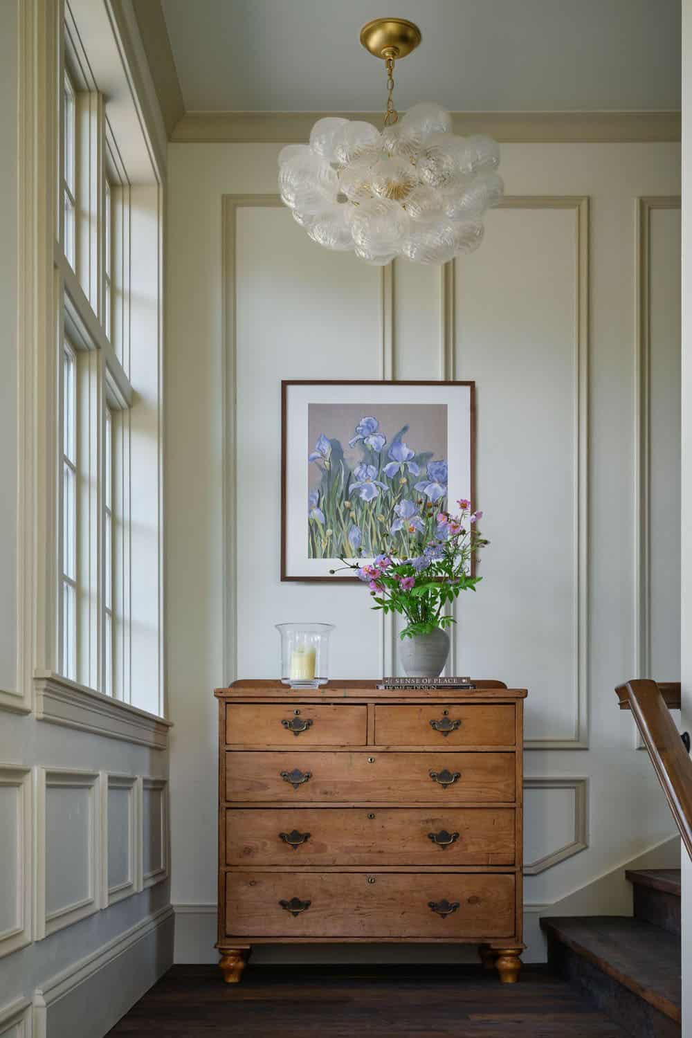 Foyer with bubble glass chandelier and antique dresser