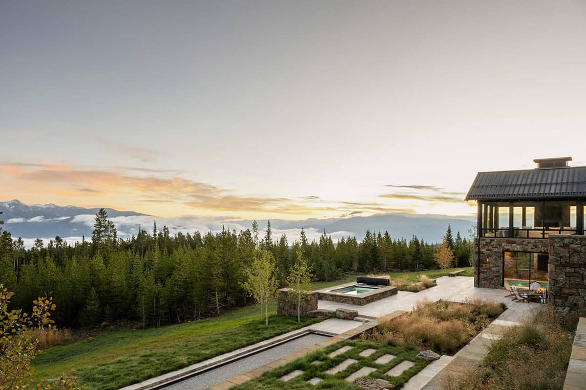 Hot tub patio overlooking pine forest and mountain valley