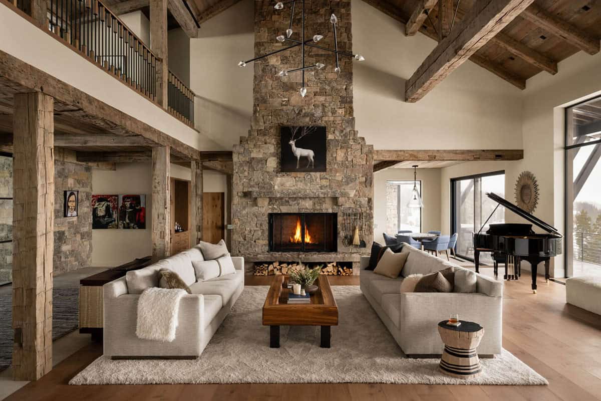 Two-story great room with stone fireplace and timber beams