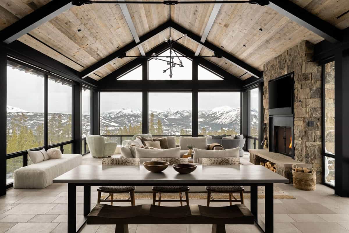 Great room with vaulted wood ceiling and panoramic mountain views