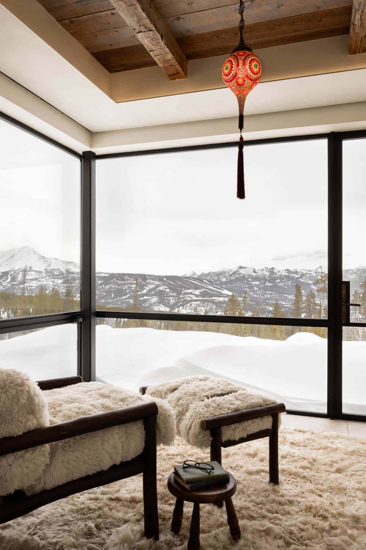 Bedroom reading nook with shaggy rug and mountain views