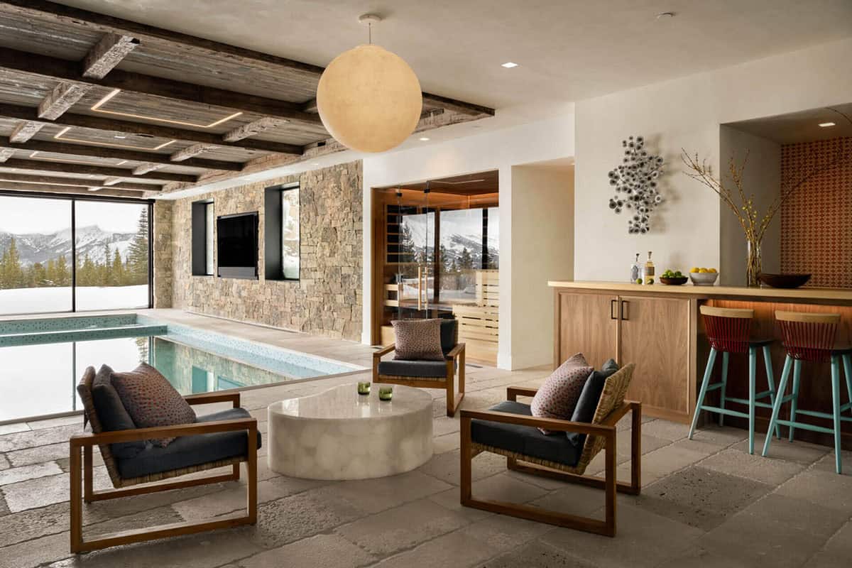 Pool lounge area with sauna entrance and wet bar