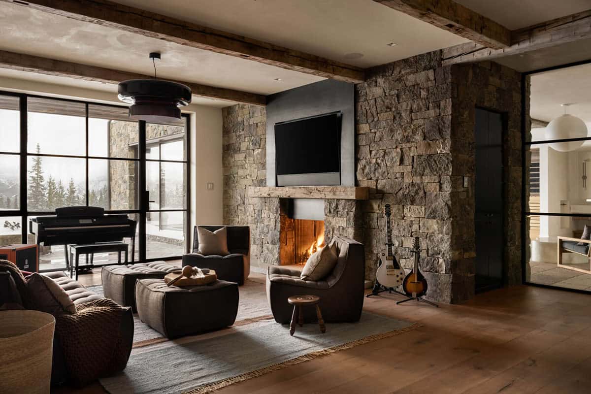 Family room with fireplace, guitars, and mountain-facing windows