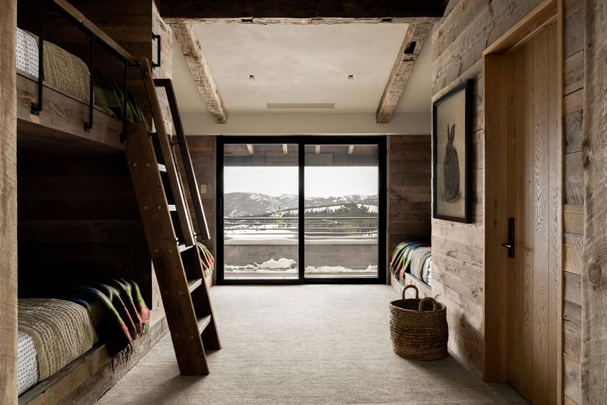 Bunk room with built-in beds and mountain-view sliding door