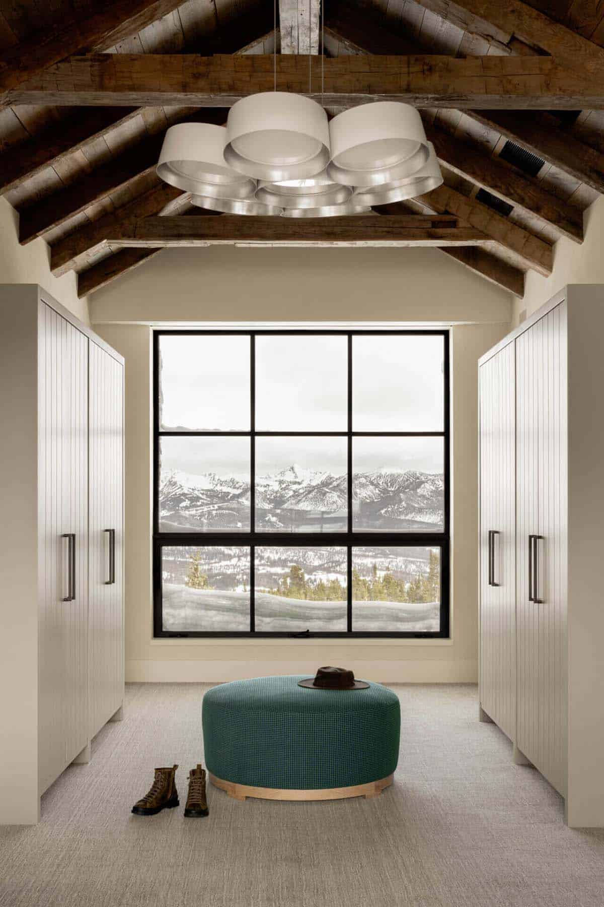 Walk-in closet with vaulted beams and picture window view