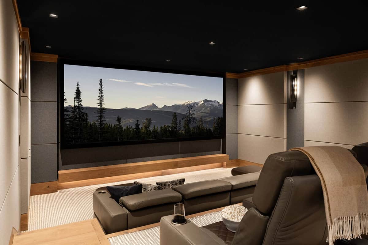 Home theater with leather sectional and mountain landscape screen