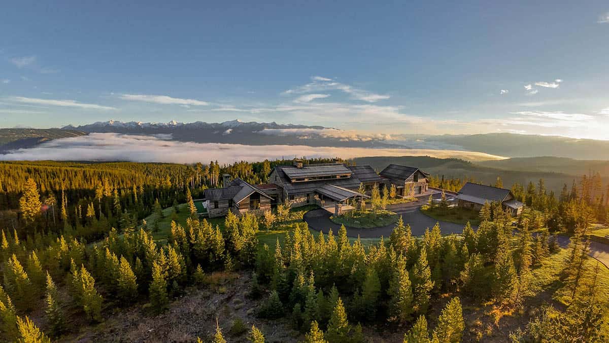 Aerial view of ski lodge compound amid pine forest
