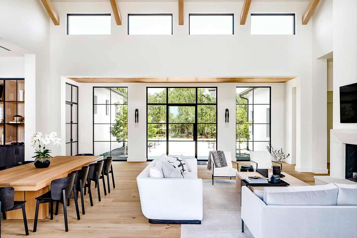 Vaulted living room with clerestory windows and steel-framed sliding doors