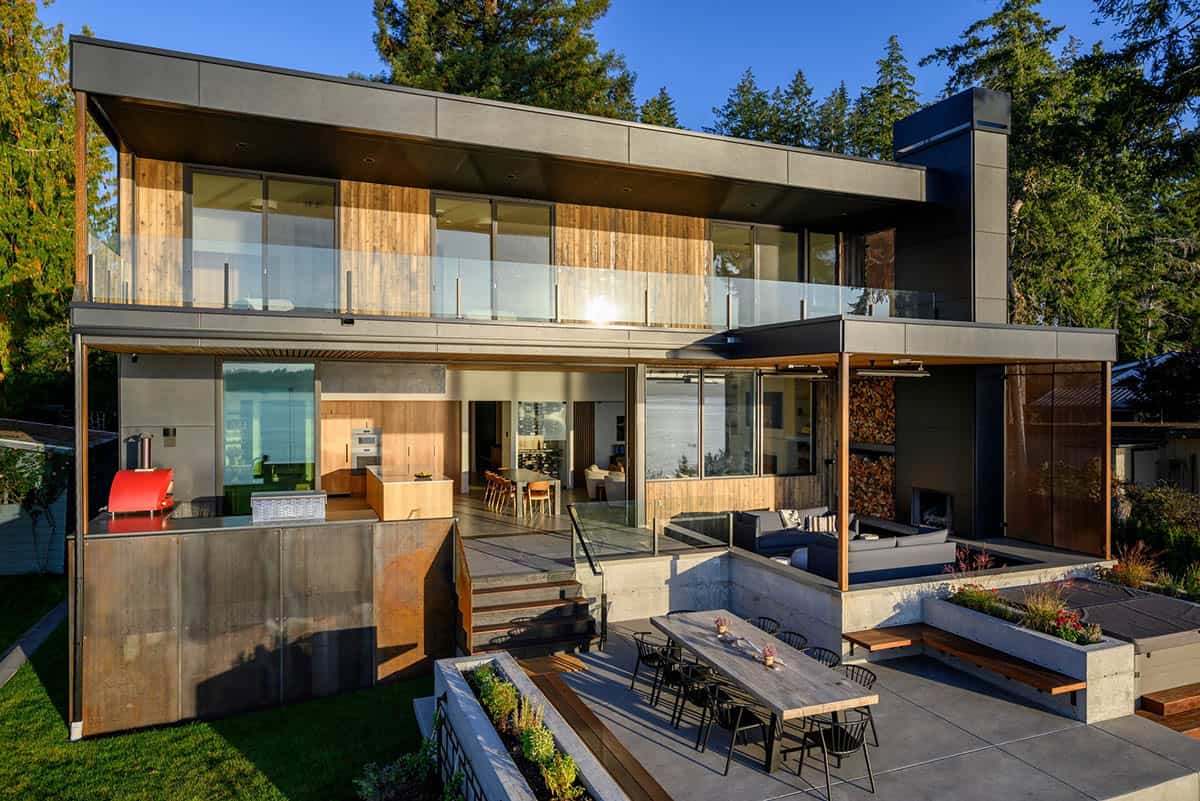 Rear elevation shows covered outdoor living and dining terrace