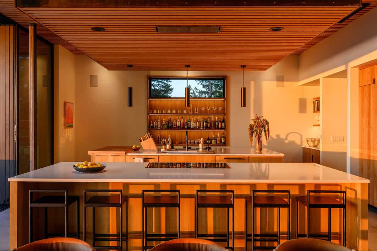 Kitchen island bar bathed in warm sunset light and shadow