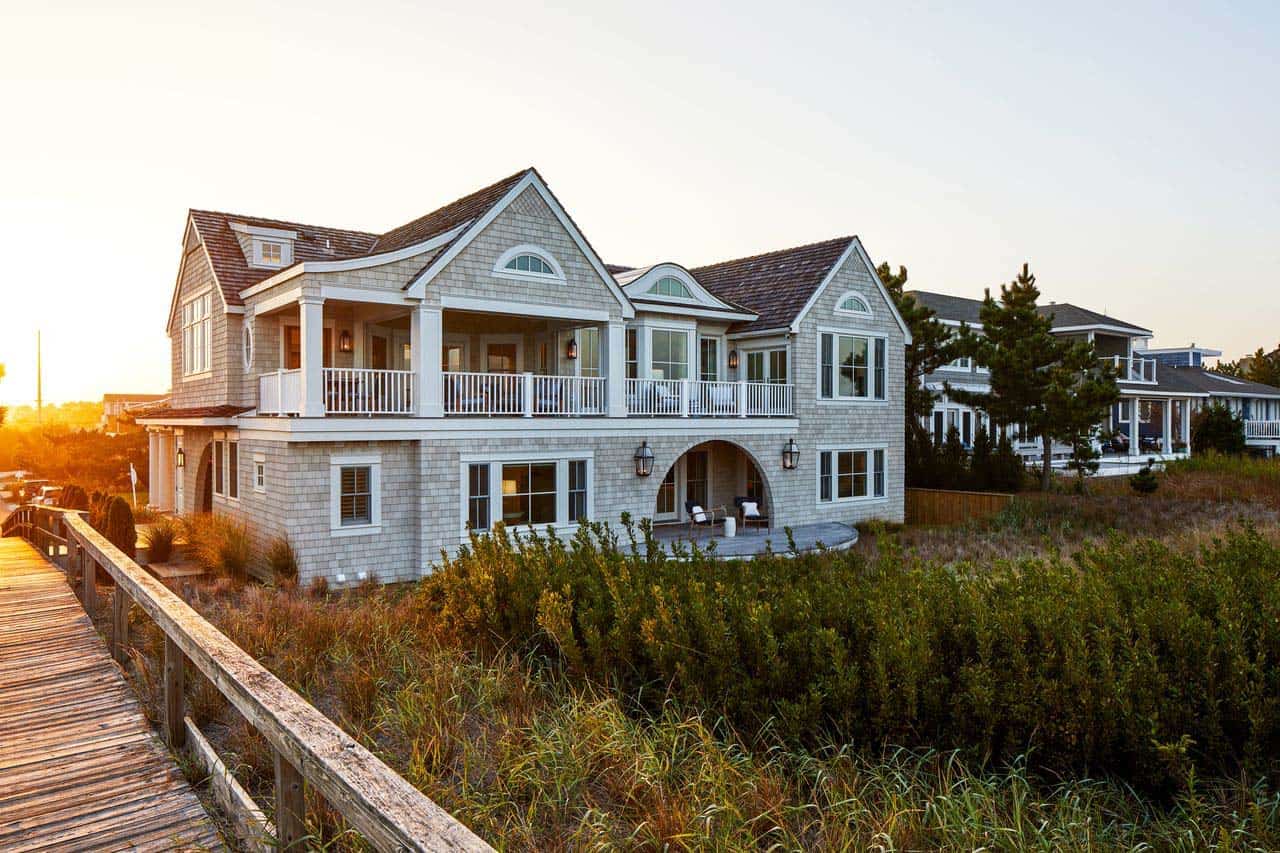 Rear facade glowing at sunset above the dune boardwalk