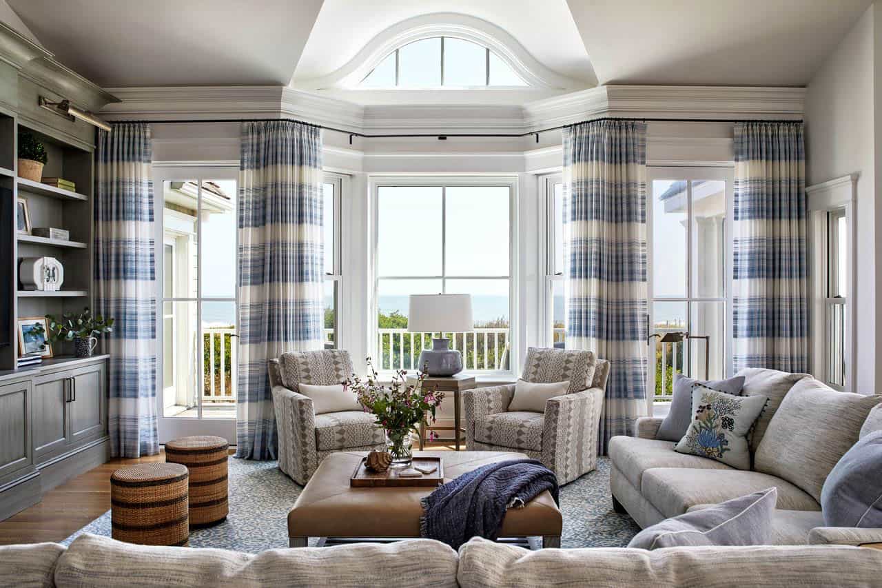 Turret living room with blue plaid curtains and ocean view