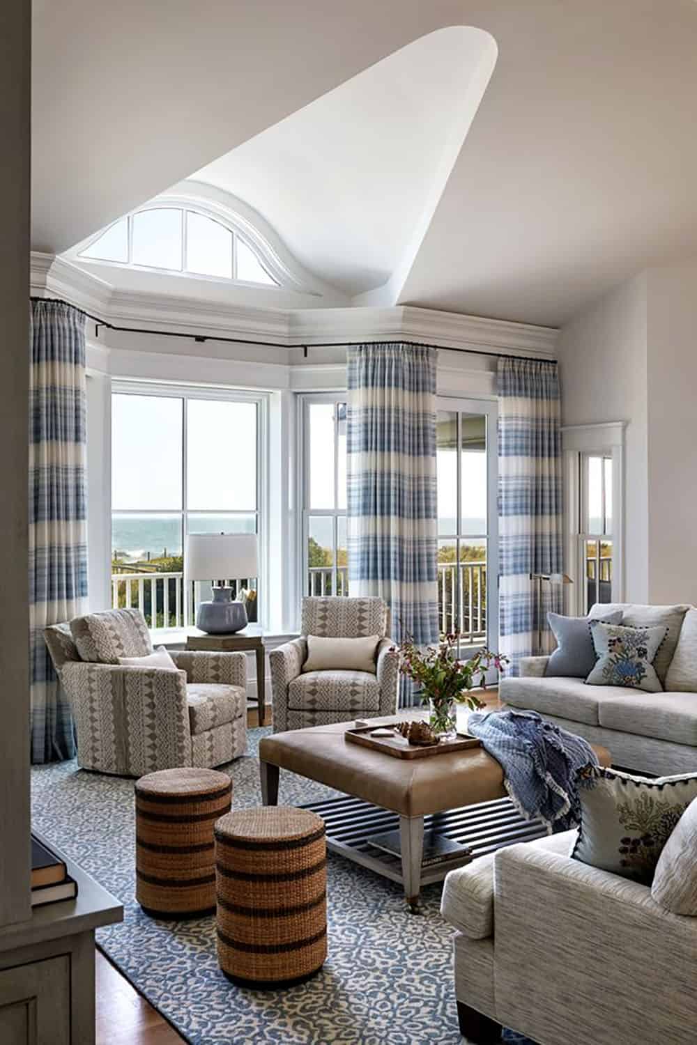 Vaulted living room with patterned rug and plaid drapery