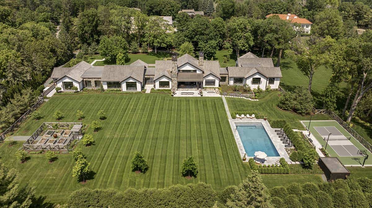 Aerial view of the backyard showing pool, tennis court, and kitchen garden layout