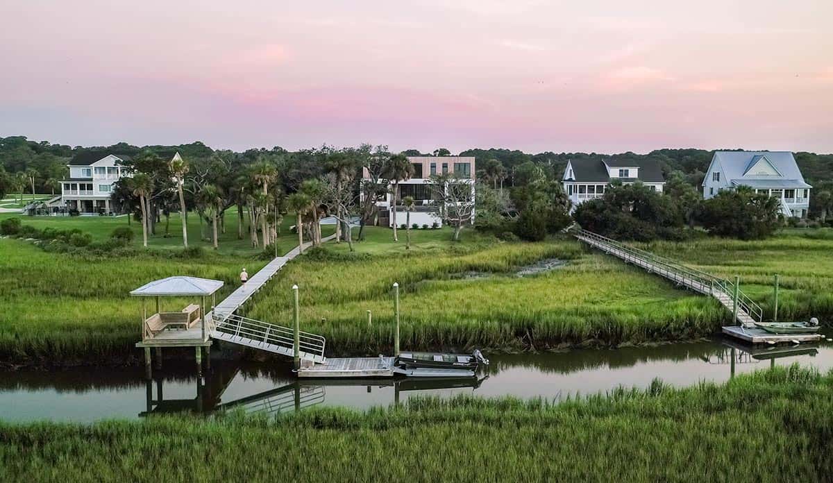 Aerial view of marsh boardwalks and docks at sunset