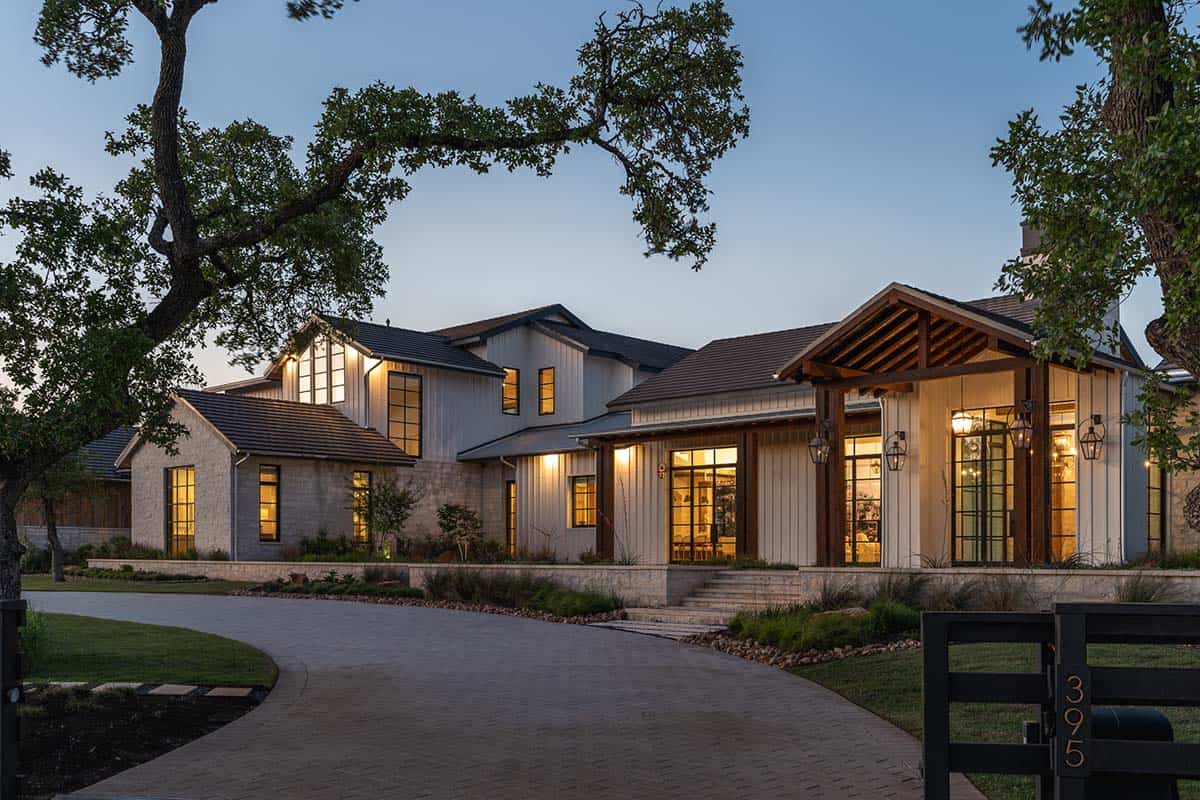 Home exterior with stone and board-and-batten facade with wood entry porch