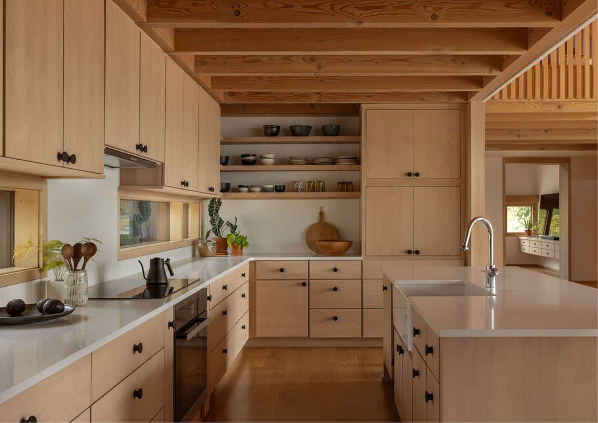 Light wood kitchen with open shelving and central island