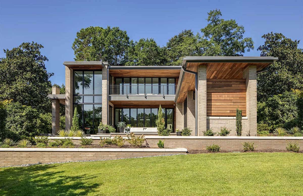 Full rear elevation of modern home showing mixed brick and cedar siding