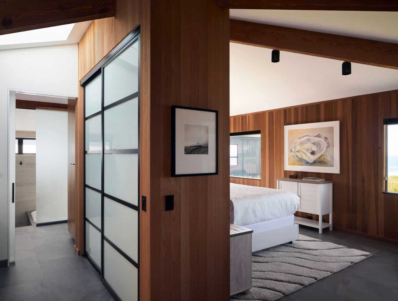 Bedroom entrance with sliding glass closet doors and ocean-view window