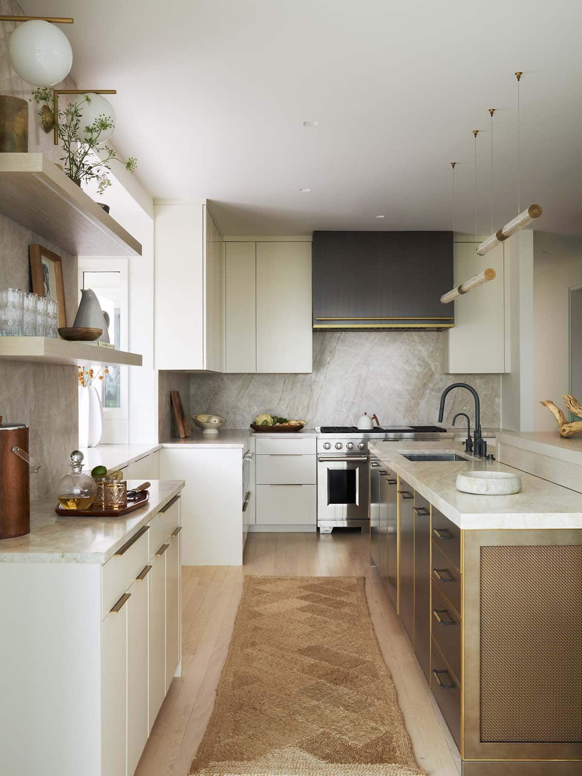 Kitchen with dark hood, marble backsplash and jute runner rug