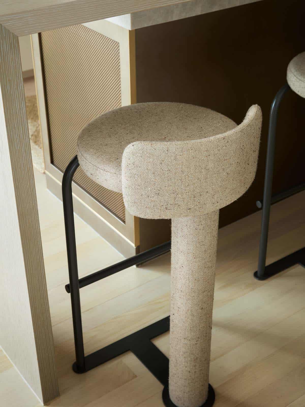 Woven bar stool detail at kitchen island
