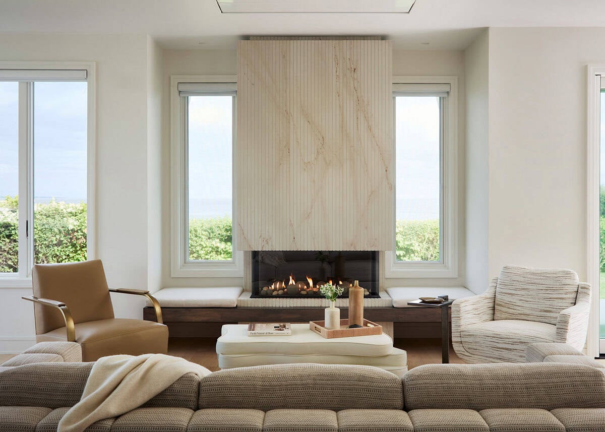 Neutral living room with fireplace and marble-clad accent wall