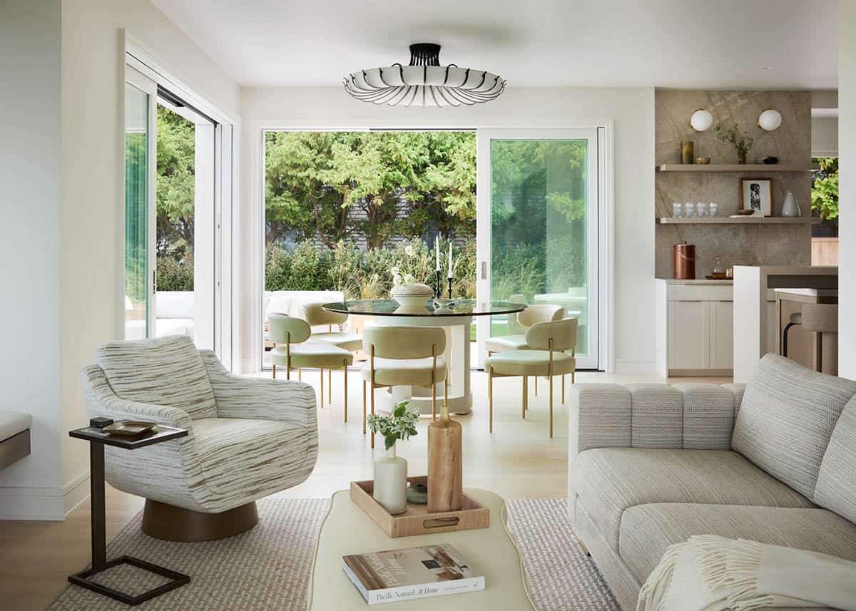 Dining area open to backyard patio and pool through sliding doors