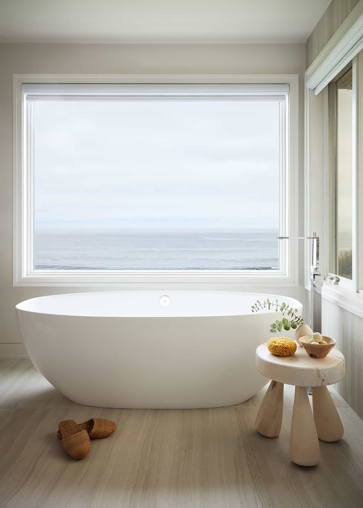 Freestanding oval soaking tub with panoramic ocean view