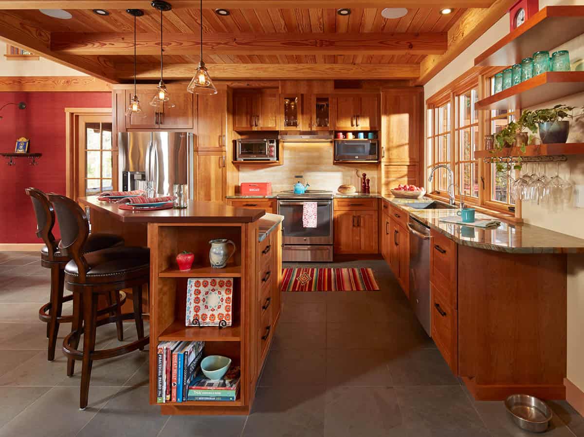 Wood kitchen with island, stainless appliances, and open shelving