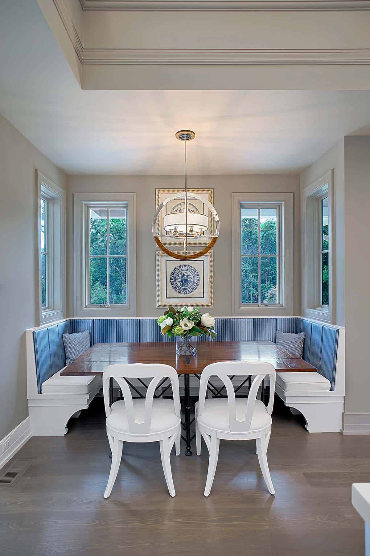 Breakfast nook with built-in blue striped banquette seating