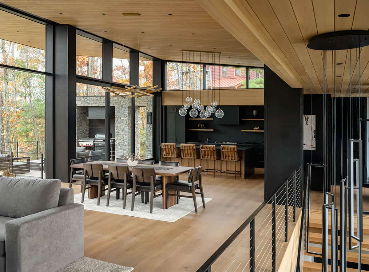 Open-concept dining and kitchen area viewed from stairway landing